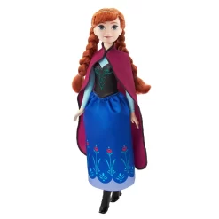 Disney Frozen Core Anna Frozen 1 - Anna-dukke, der kan poseres, i sin ikoniske rejsestil med kappe, nederdel og sko. Perfekt til børn fra 3 år til at genskabe Frozen-eventyr. 